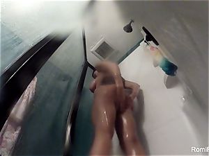 porn industry star Romi Rain brings her camera in the bathroom